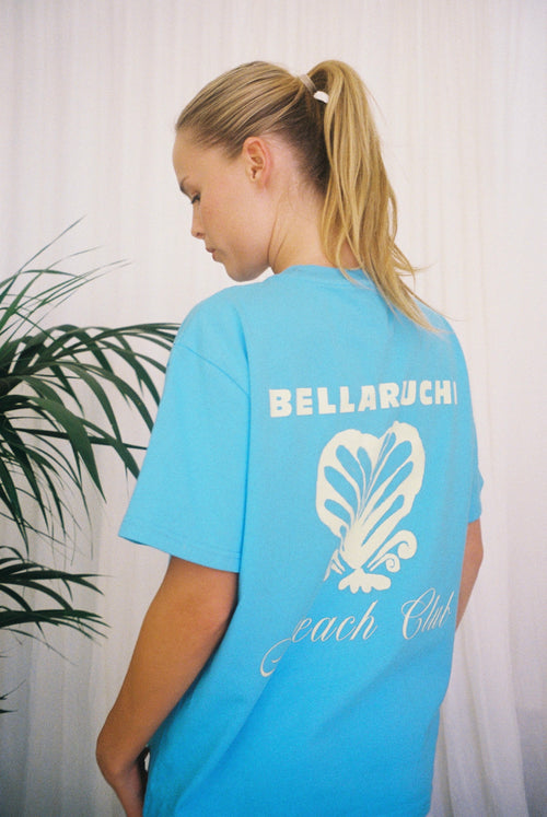 Blue T-shirt BELLARUCHI. Blue T-shirt with shell. Blue t-shirt yellow writing. Blue tshirt yellow back logo. BELLARUCHI Blue tee. Boxy Blue tee. Aqua Boxy Tee. Aqua Tee. 