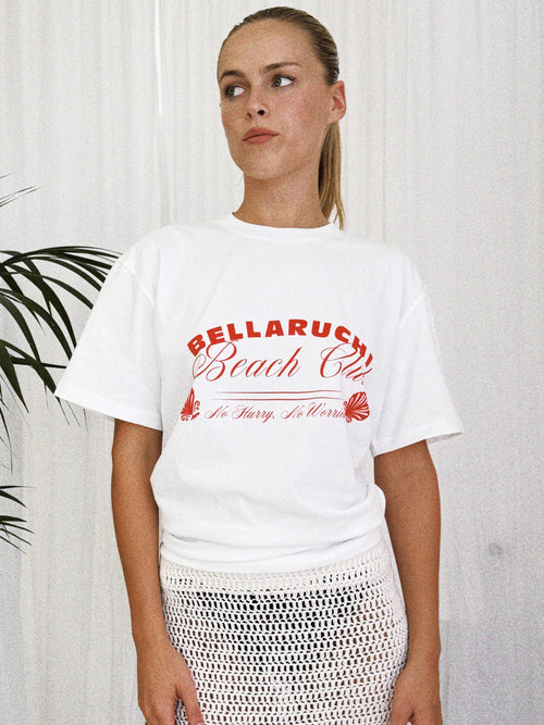 white t-shirt red writing. BELLARUCHI beach club tee. boxy logo tee. vintage feel tee. vintage tee. mid weight tshirt. cool tshirt. 