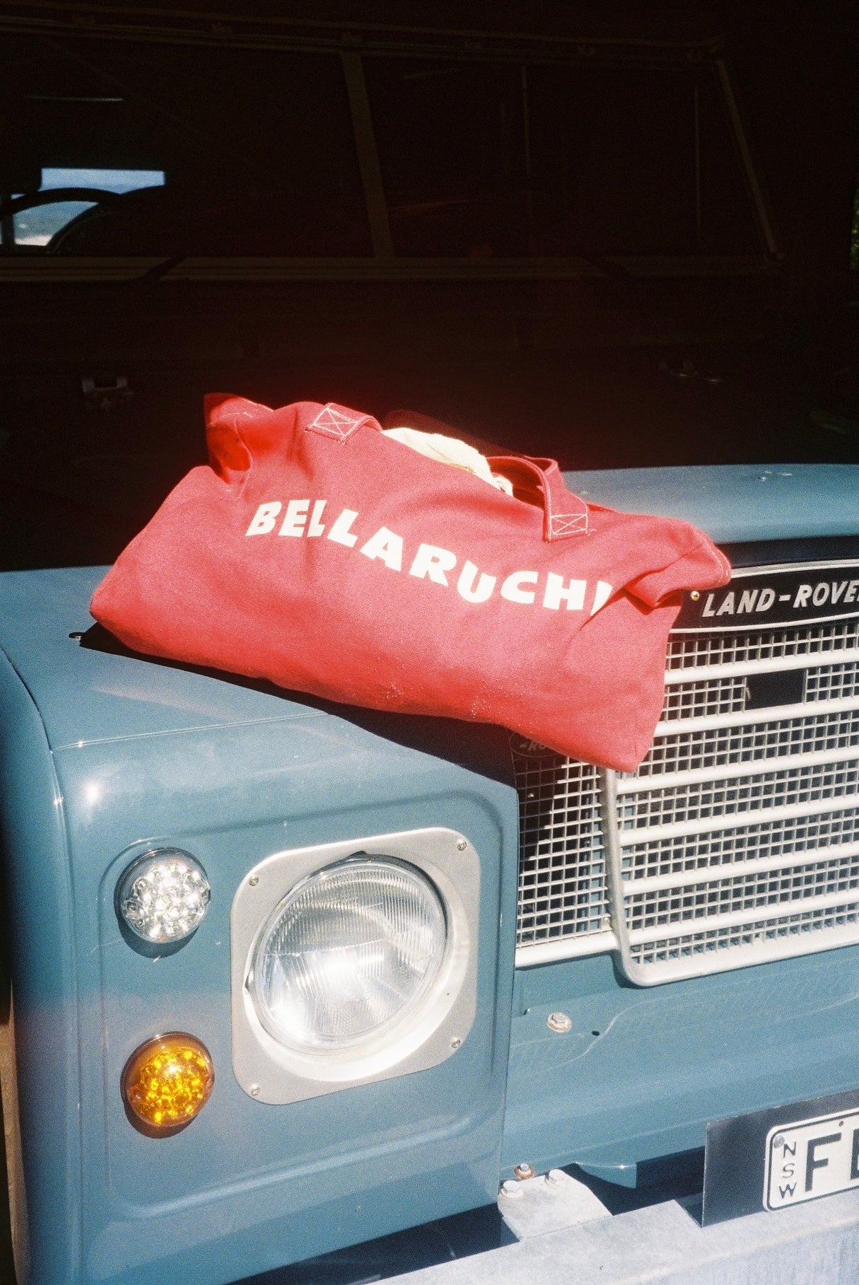 BELLARUCHI beach tote bag 
Red bag, white logo 