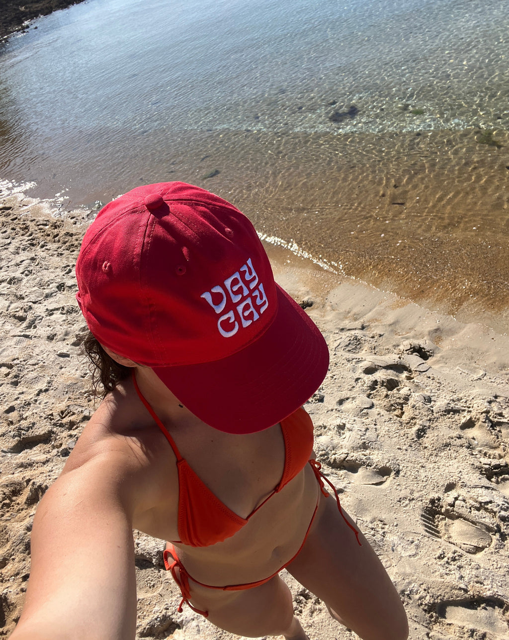 BELLARUCHI VAYCAY RED AND WHITE CAP. vaycay red cap. Red Cap white writing. Baseball Cap/. Vacation Cap. 
