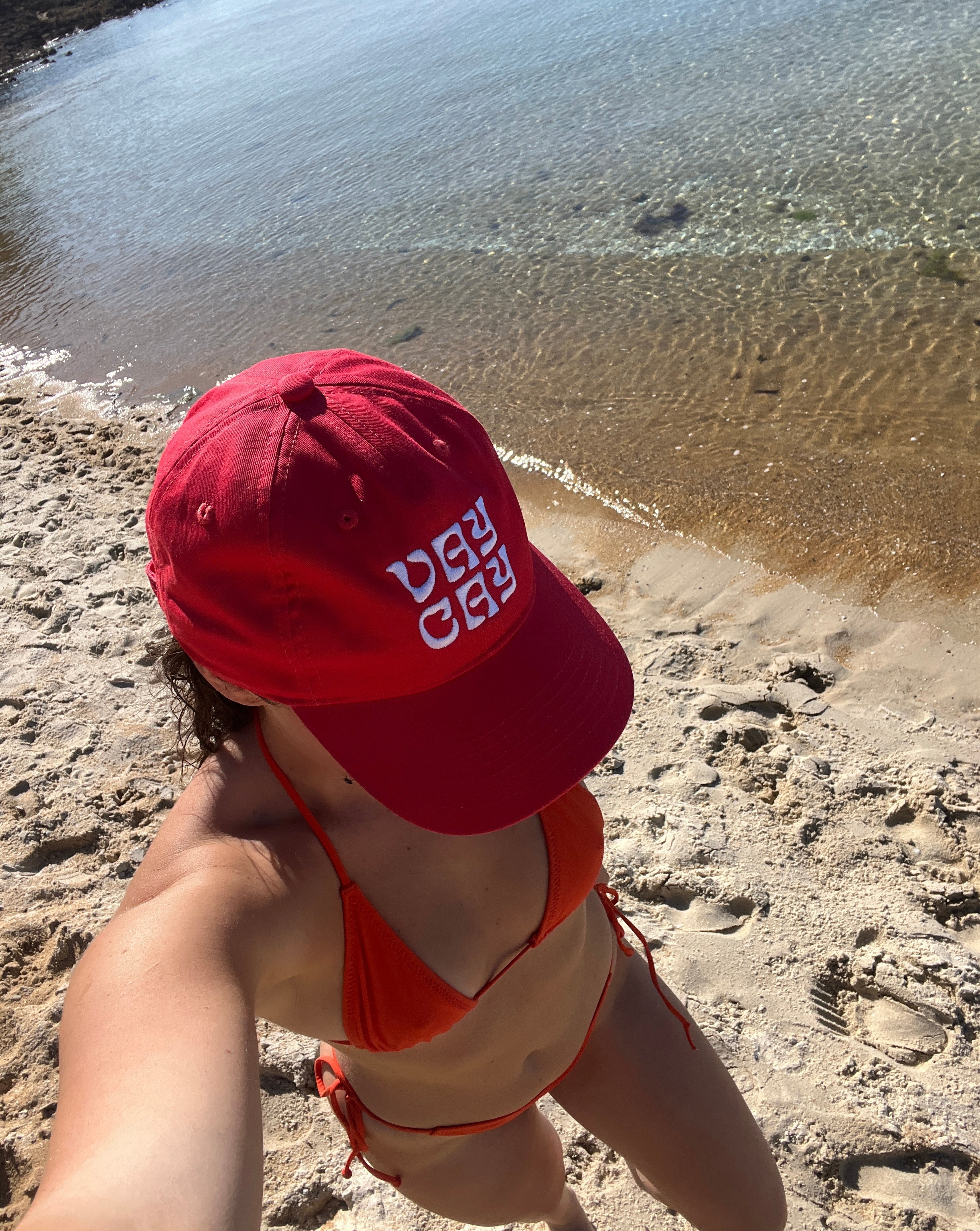 BELLARUCHI VAYCAY RED AND WHITE CAP. vaycay red cap. Red Cap white writing. Baseball Cap/. Vacation Cap. 