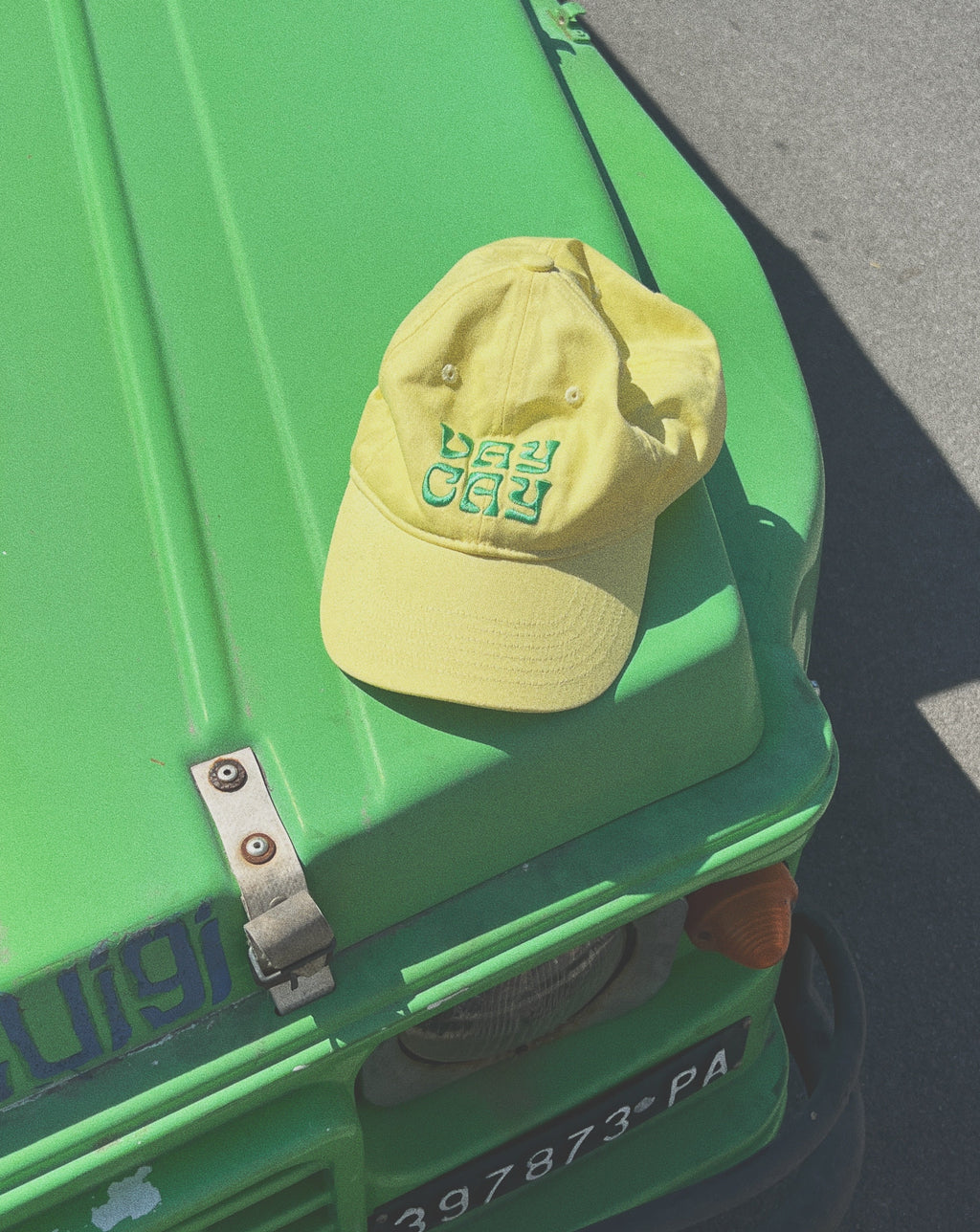 BELLARUCHI VAYCAY CAP YELLOW. Yellow Cap Green Writing. Yellow travel Cap. Travel Cap. Vacation Cap. Holiday Cap. Yellow Cap VAYCAY Writing. 
