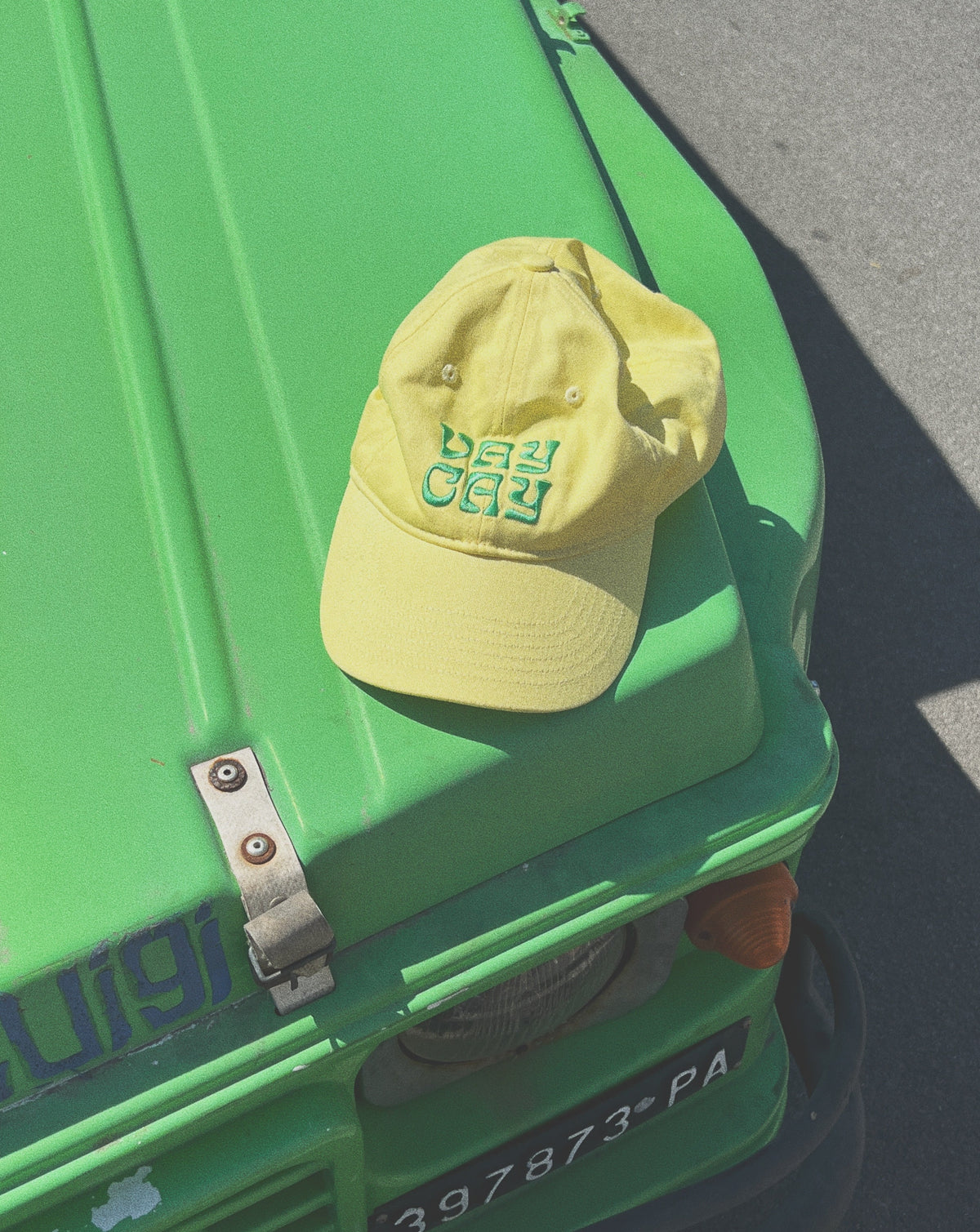 BELLARUCHI VAYCAY CAP YELLOW. Yellow Cap Green Writing. Yellow travel Cap. Travel Cap. Vacation Cap. Holiday Cap. Yellow Cap VAYCAY Writing. 
