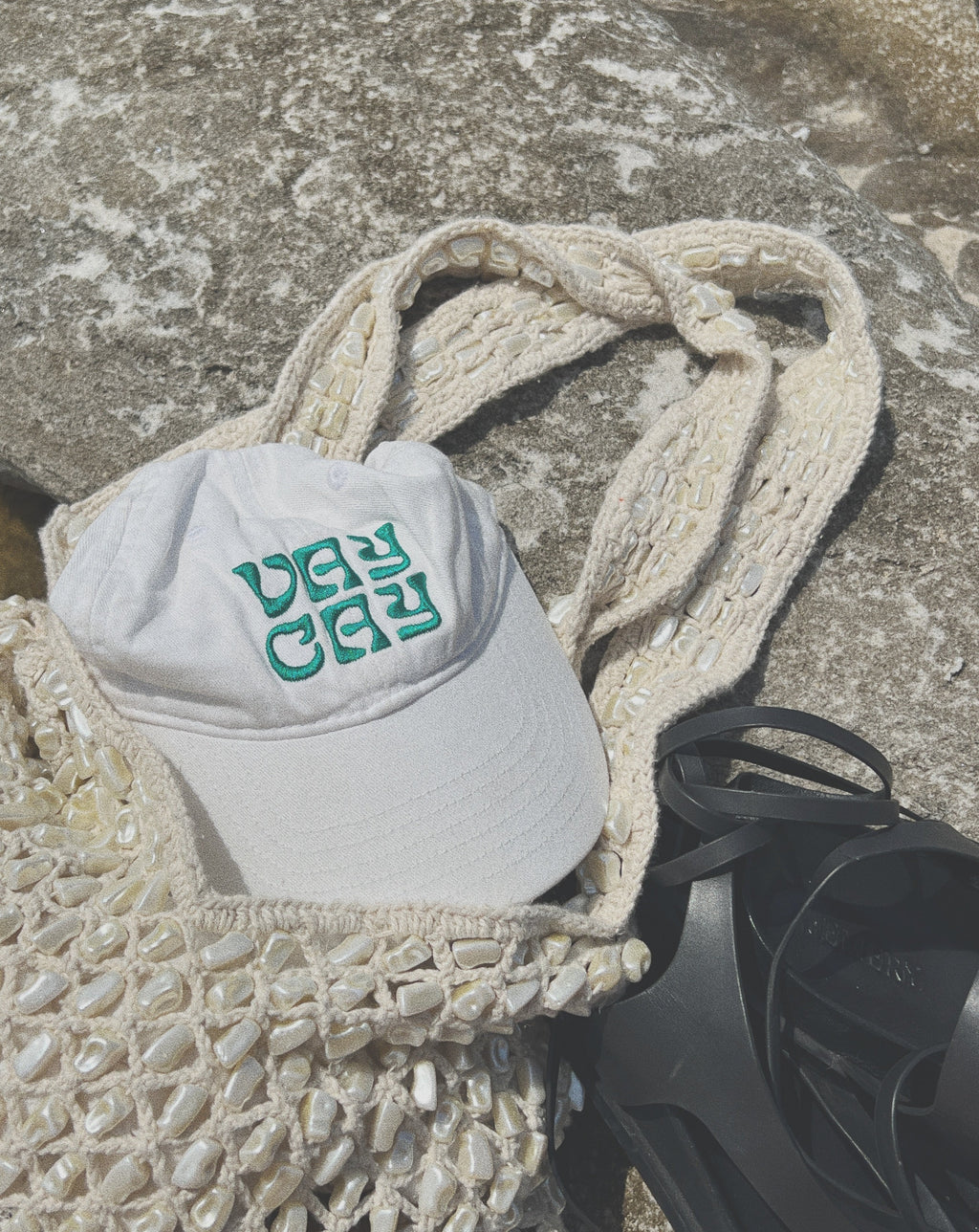 BELLARUCHI CAP WHITE AND GREEN VAYCAY. White Cap Green Writing. Vaycay Cap. White Cap. Vintage feel Cap. Summer Cap. Travel Cap White. 