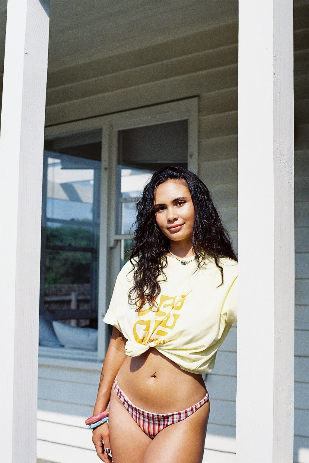 BELLARUCHI VAYCAY TEE YELLOW. Vaycay T-shirt. Yellow Vintage T-shirt. Vintage Vibe T-shirt. Mid weight t-shirt. Colourful Tshirt. Yellow Tee with Orange VAYCAY logo. BELLARUCHI Travel Tee. 