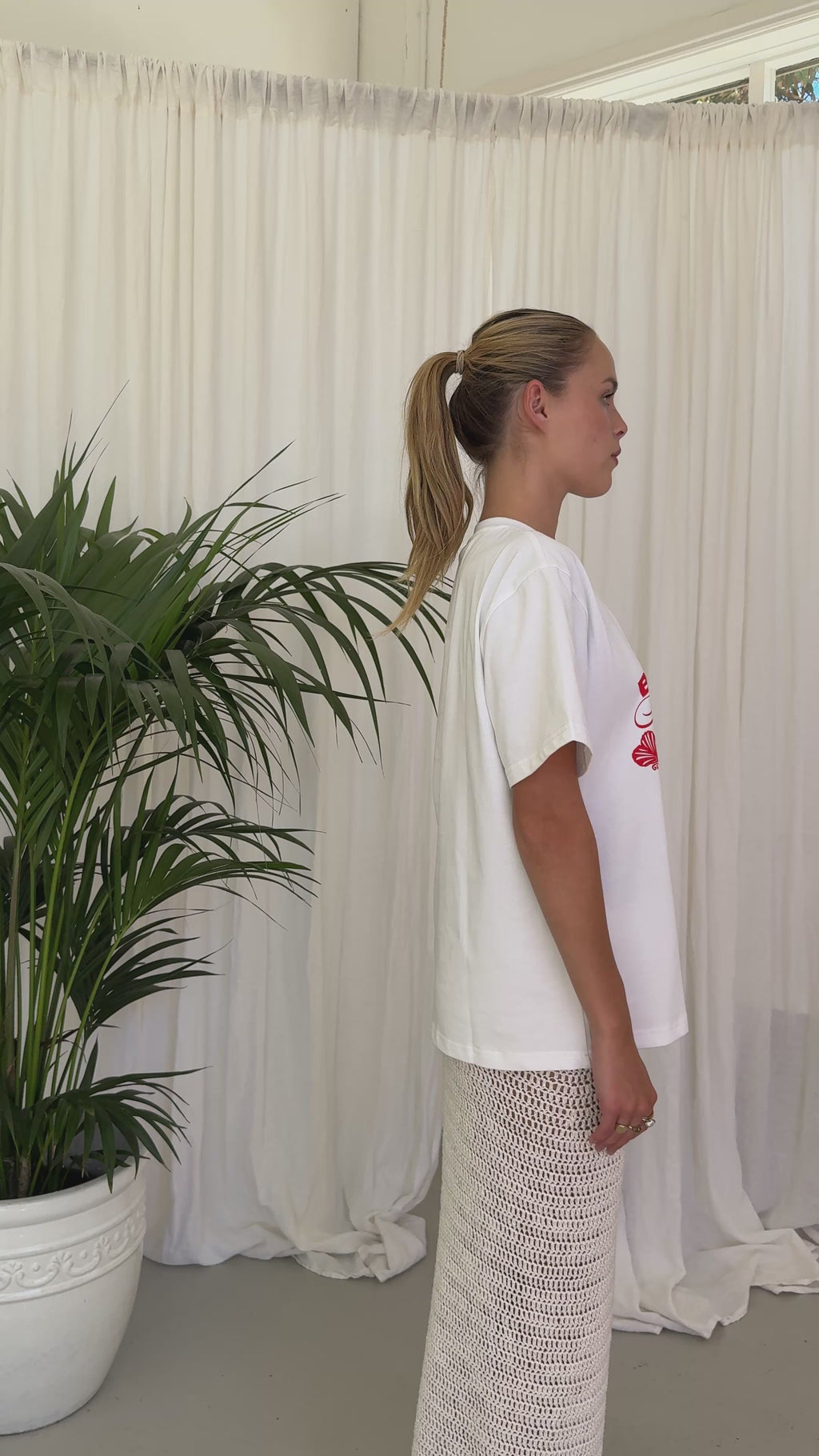 white t-shirt red writing. BELLARUCHI beach club tee. boxy logo tee. vintage feel tee. vintage tee. mid weight tshirt. cool tshirt. 