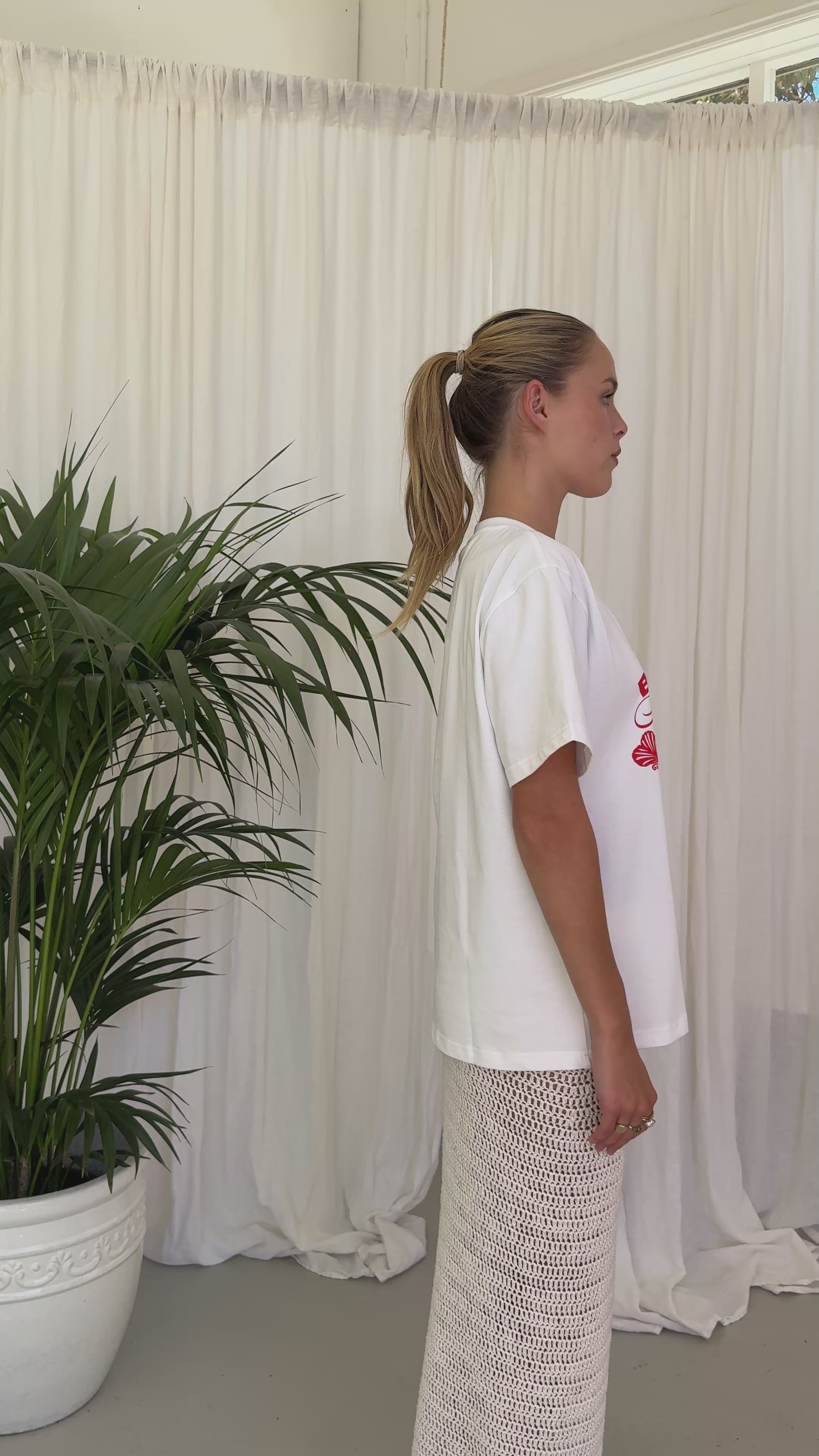 white t-shirt red writing. BELLARUCHI beach club tee. boxy logo tee. vintage feel tee. vintage tee. mid weight tshirt. cool tshirt. 