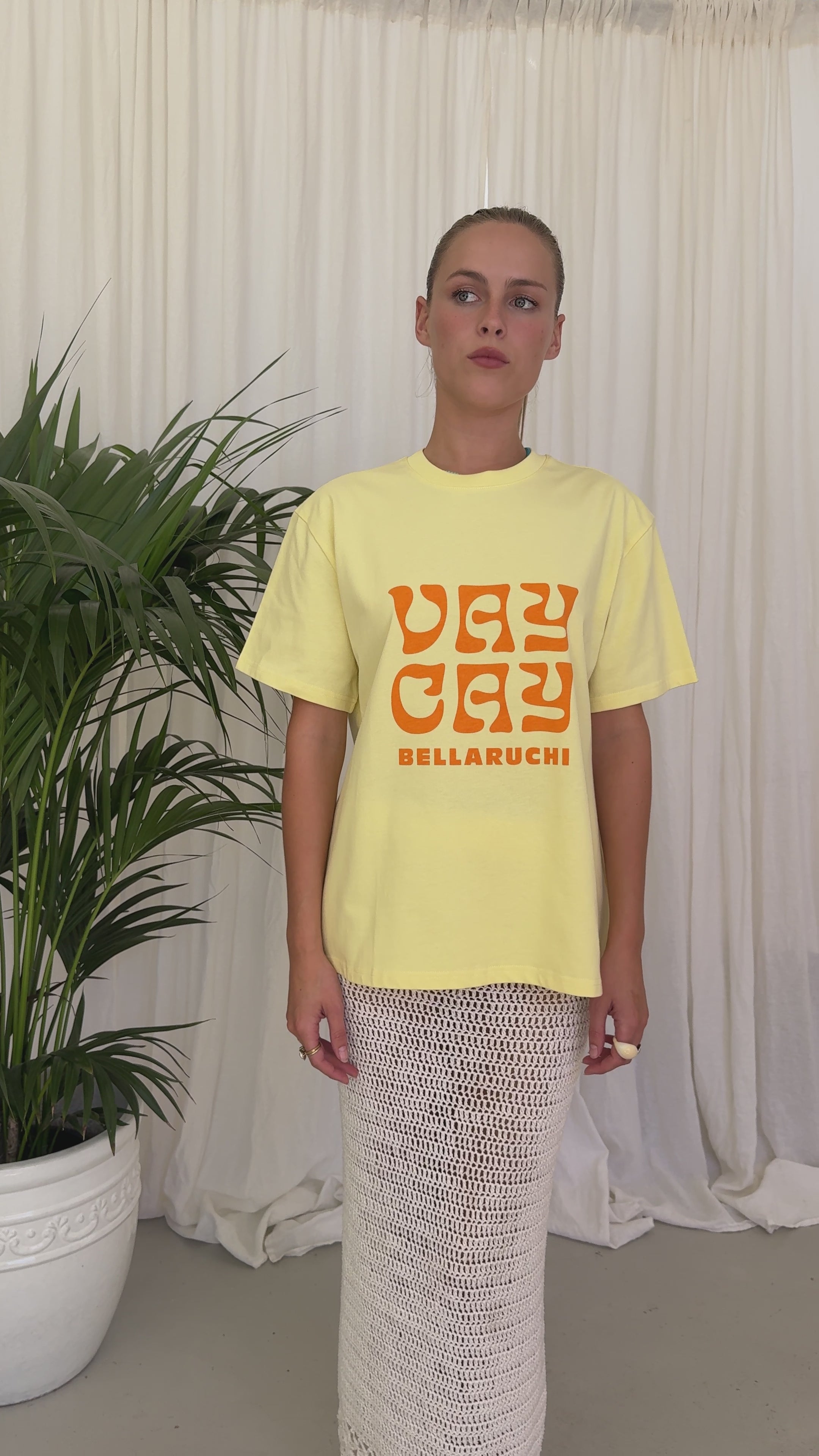 BELLARUCHI VAYCAY TEE YELLOW. Vaycay T-shirt. Yellow Vintage T-shirt. Vintage Vibe T-shirt. Mid weight t-shirt. Colourful Tshirt. Yellow Tee with Orange VAYCAY logo. BELLARUCHI Travel Tee. 